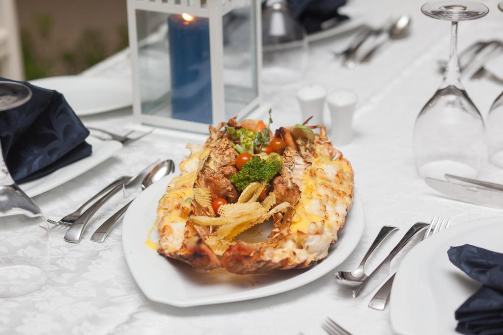 Rixos Alamein - Full Board Plus Эль-Аламейн Экстерьер фото A lobster prepared in the New England style